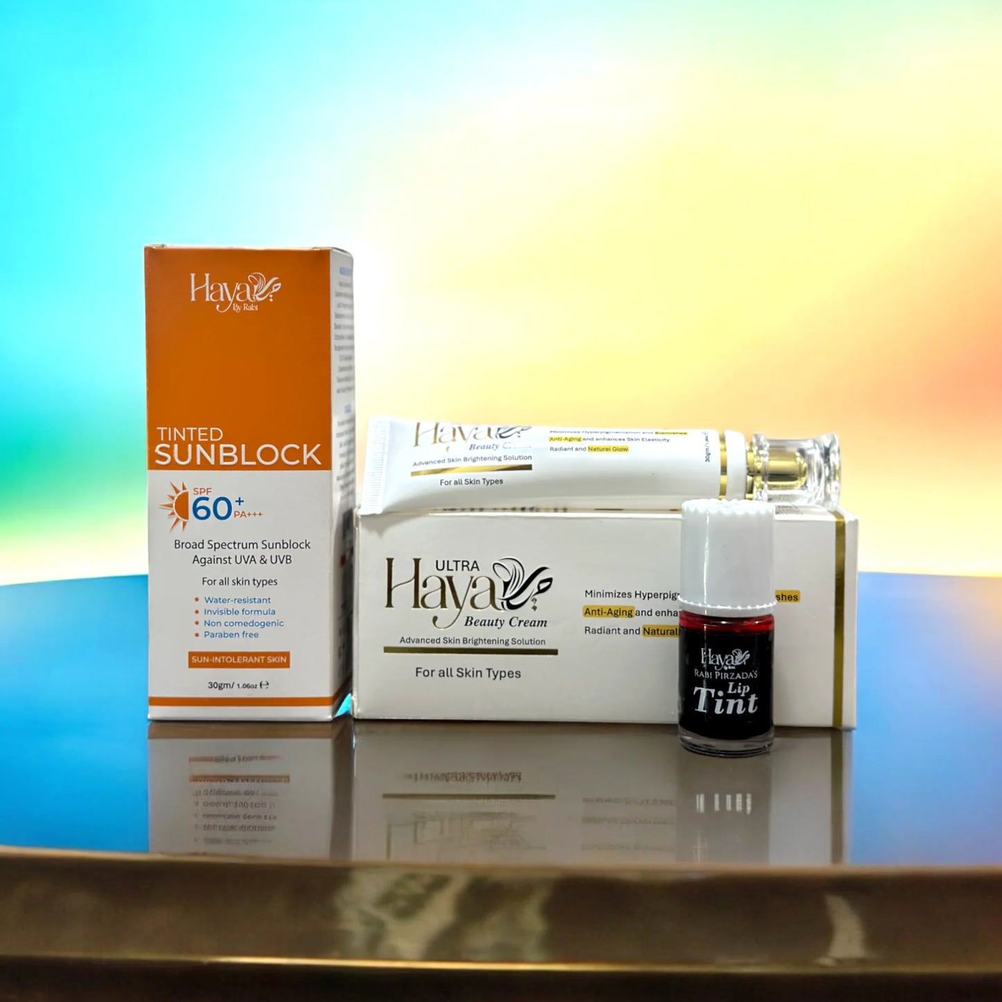 Haya by Rabi Tinted Sunblock SPF 60, Ultra Beauty Cream, and Lip Tint skincare bundle.