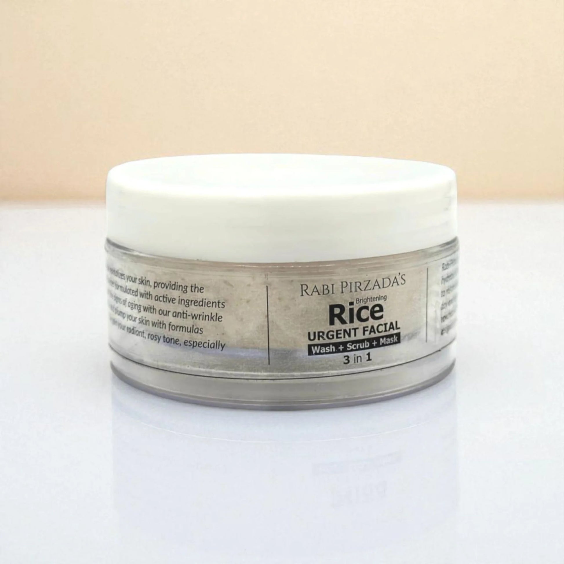 Side view of Rabi Pirzada’s Brightening Rice Urgent Facial jar on a white surface.